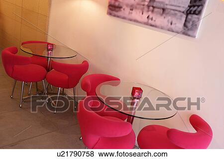 Interiors-leisure space with table and styled chairs View Large Photo Image Stock Photo - Interiors-leisure space with table and styled chairs. Fotosearch