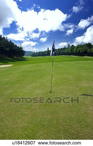 Flag in golf course View Large Photo Image Stock Photo - Flag in golf course. Fotosearch