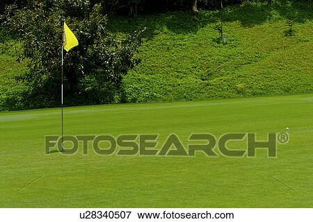 Stock Photo - Flag in golf course. Fotosearch