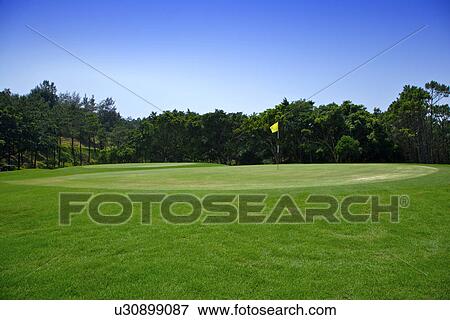 Flag in golf course View Large Photo Image Stock Photo - Flag in golf course. Fotosearch