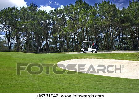 Golf cart in golf course View Large Photo Image Stock Image - Golf cart in golf course. Fotosearch