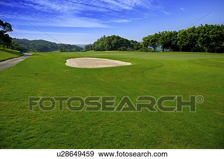 Golf course with green and sand traps View Large Photo Image Stock Photo - Golf course with green and sand traps. Fotosearch