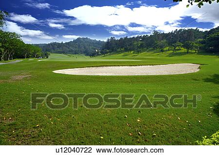 Stock Image - Sand trap in golf course. Fotosearch