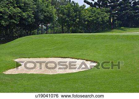 Stock Photograph - Sand trap in golf course. Fotosearch
