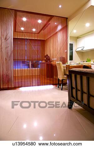 Stock Image - Domestic kitchen separated by curtain. Fotosearch