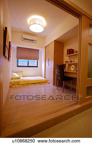 Stock Image - Interior view of bedroom. Fotosearch