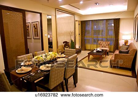 Stock Image - Living room and dining table. Fotosearch