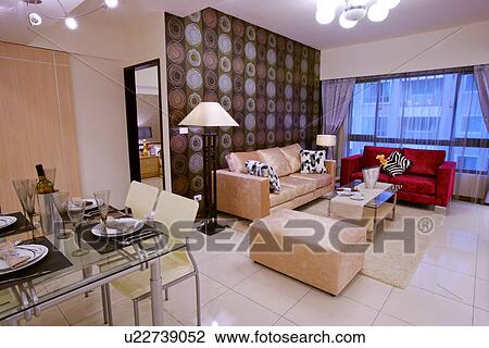 Stock Image - Modern style living room with dinning table. Fotosearch