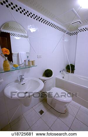 Stock Image - Toilet, sink and tub in bathroom. Fotosearch