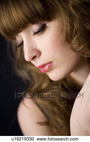Studio shot of teenage girl with makeup and eyes closed View Large Photo Image Stock Image - Studio shot of teenage girl with makeup and eyes closed. Fotosearch