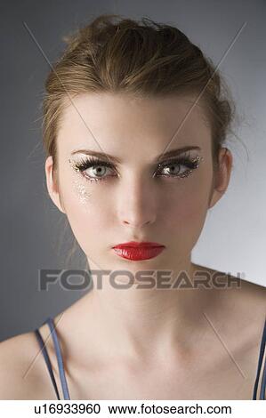 Studio shot of teenage girl with makeup View Large Photo Image Stock Image - Studio shot of teenage girl with makeup. Fotosearch