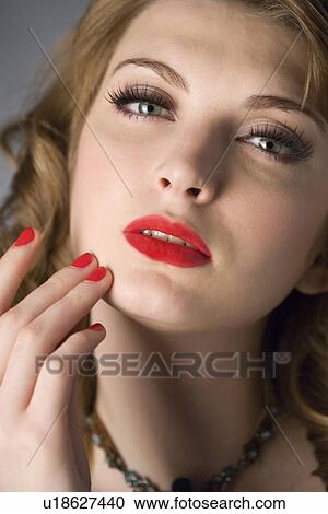 Studio shot of teenage girl with makeup and fingernails with nail polish View Large Photo Image Stock Image - Studio shot of teenage girl with makeup and fingernails with nail polish. Fotosearch