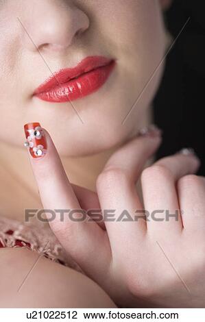 Studio shot of teenage girl with makeup and artificial fingernails View Large Photo Image Stock Image - Studio shot of teenage girl with makeup and artificial fingernails. Fotosearch