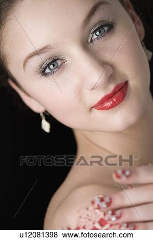 Stock Photo - Studio shot of teenage girl with makeup. Fotosearch