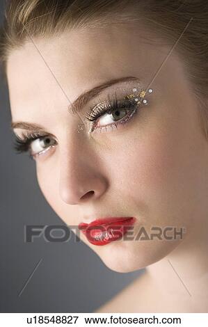 Studio shot of teenage girl with makeup View Large Photo Image Stock Photo - Studio shot of teenage girl with makeup. Fotosearch