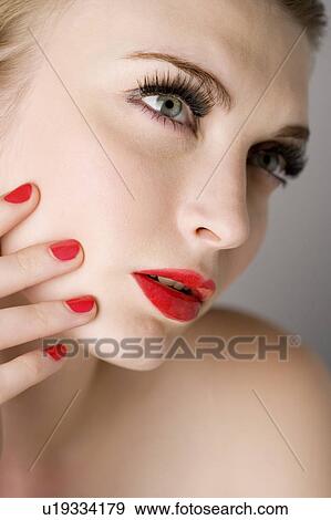 Stock Photo - Studio shot of teenage girl with makeup. Fotosearch