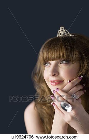 Studio shot of teenage girl with makeup, jewelries and artificial fingernails View Large Photo Image Stock Photograph - Studio shot of teenage girl with makeup, jewelries and artificial fingernails. Fotosearch