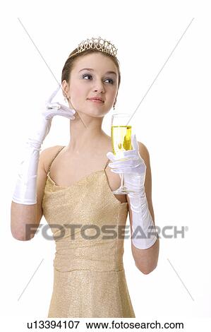 Stock Photo - Teenage girl holding a glass of beer. Fotosearch