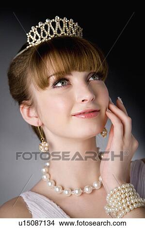 Picture - Teenage girl wearing jewelries. Fotosearch