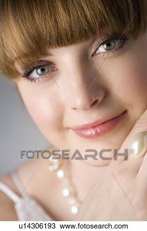 Stock Image - Teenage girl wearing jewelries. Fotosearch