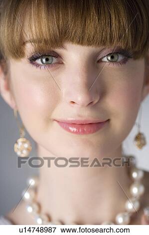 Stock Photo - Teenage girl wearing jewelries. Fotosearch