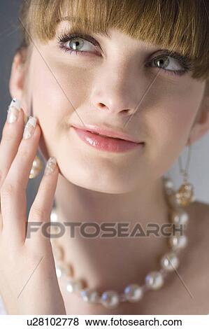 Teenage girl with artificial fingernails wearing jewelries View Large Photo Image Stock Photo - Teenage girl with artificial fingernails wearing jewelries. Fotosearch