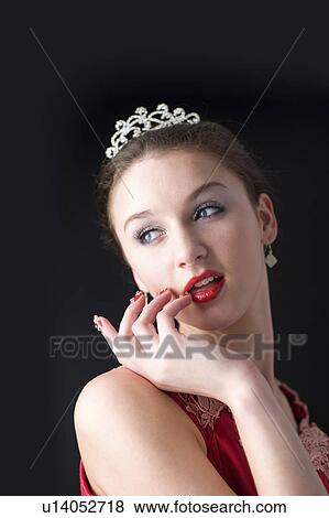 Stock Photo - Teenage girl with makeup and artificial fingernails. Fotosearch