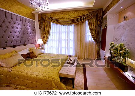 Stock Image - View of a contemporary bedroom. Fotosearch