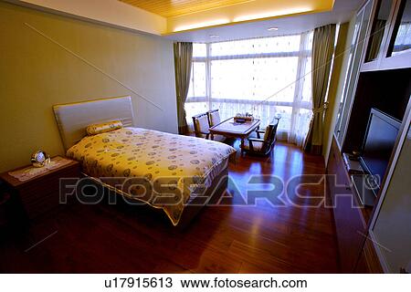 View of a contemporary bedroom View Large Photo Image Stock Image - View of a contemporary bedroom. Fotosearch