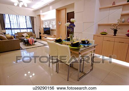 Stock Photograph - View of a contemporary living room and dinning room. Fotosearch
