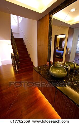 View of a contemporary room with staircase and big mirror View Large Photo Image Stock Photo - View of a contemporary room with staircase and big mirror. Fotosearch