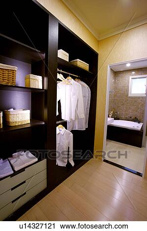 Wardrobe with shirts and bathroom View Large Photo Image Stock Image - Wardrobe with shirts and bathroom. Fotosearch