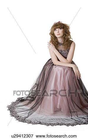 Stock Photo - Studio shot of teenage girl in formal dress. Fotosearch