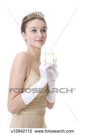 Stock Image - Teenage girl holding a glass of beer. Fotosearch