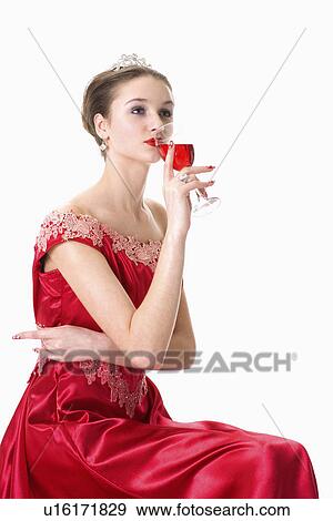 Teenage girl in formal dress drinking red wine View Large Photo Image Stock Photo - Teenage girl in formal dress drinking red wine. Fotosearch