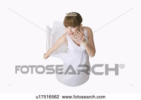 Stock Image - Teenage girl in formal dress, high angle view. Fotosearch