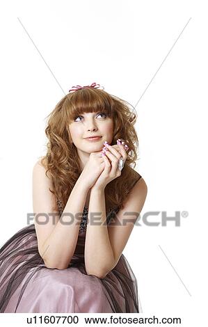 Teenage girl in formal dress, looking up View Large Photo Image Stock Image - Teenage girl in formal dress, looking up. Fotosearch