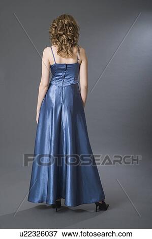 Teenage girl in formal dress, rear view View Large Photo Image Stock Photo - Teenage girl in formal dress, rear view. Fotosearch