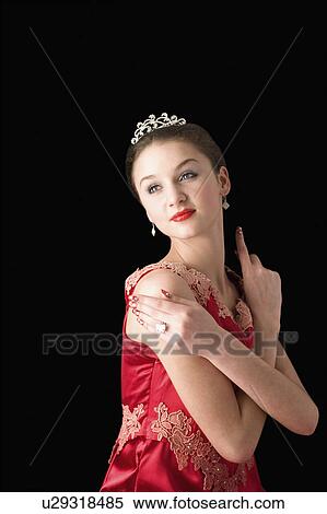 Stock Photography - Teenage girl in formal dress with arms crossed. Fotosearch