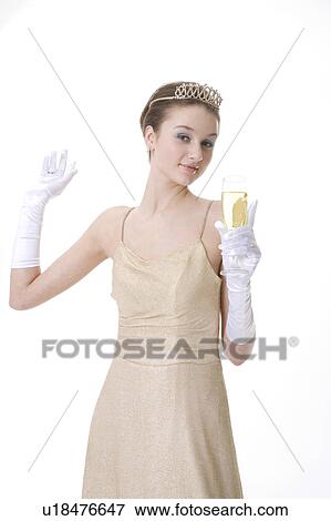 Stock Photo - Teenage girl wearing crown holding a glass of beer. Fotosearch