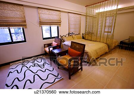 Stock Image - Contemporary room with beds. Fotosearch