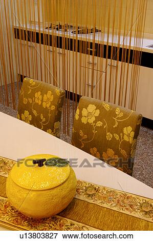 Stock Photo - Dinning table and kitchen. Fotosearch