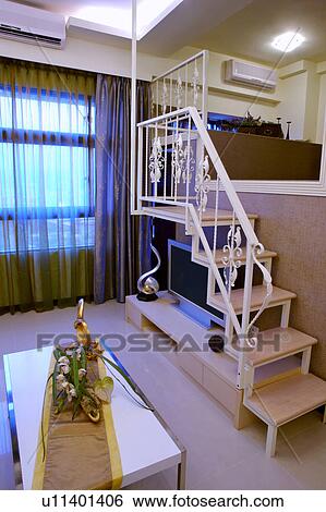 Stock Photograph - Interior of living room with staircase. Fotosearch