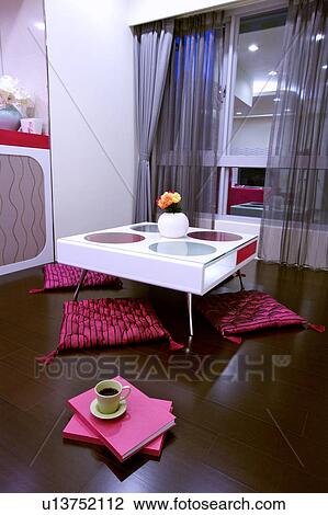 Square table, a cup of coffee, books and mats in room View Large Photo Image Stock Image - Square table, a cup of coffee, books and mats in room. Fotosearch