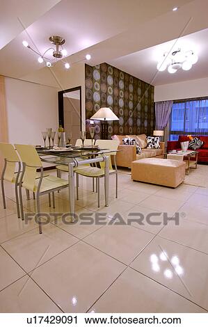Stock Image - Table setting and living room. Fotosearch