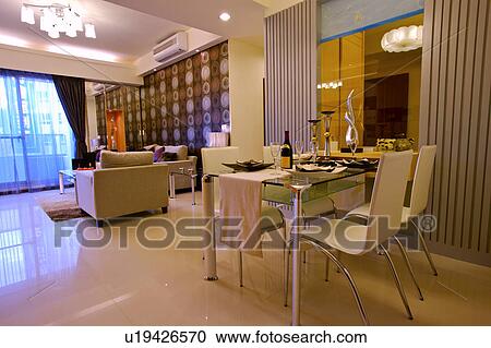Stock Image - Table setting and living room. Fotosearch