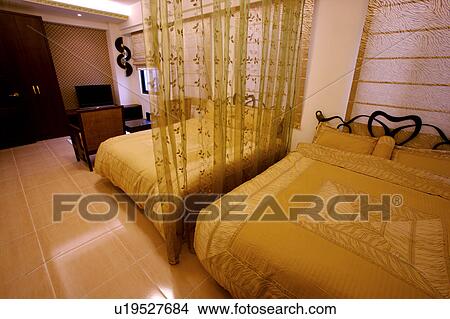 Picture - Two beds in room. Fotosearch