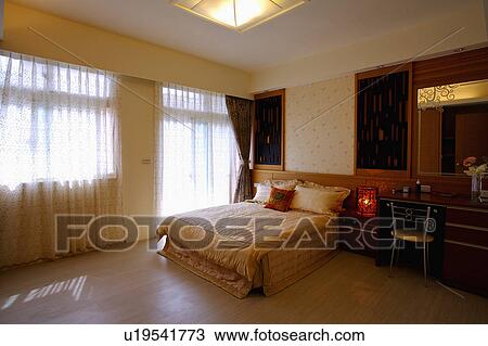 Stock Image - Home interior of bedroom with modern style. Fotosearch