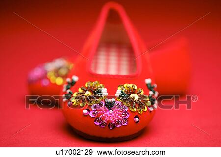 Stock Photo - A pair of red satin shoes. Fotosearch