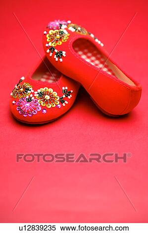 Stock Photography - A pair of red satin shoes. Fotosearch